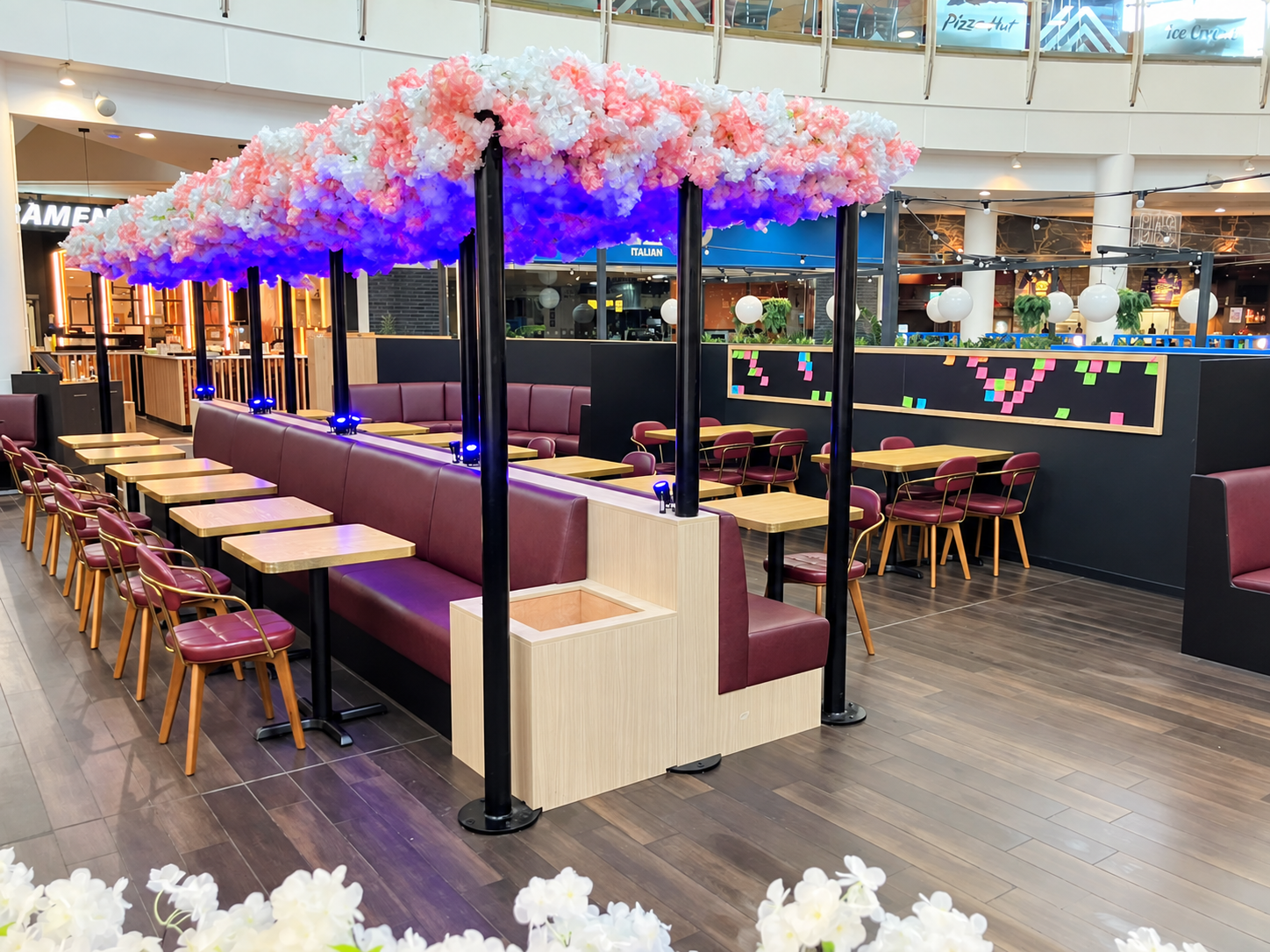 Completed Maki and Ramen seating area beneath the floral canopy